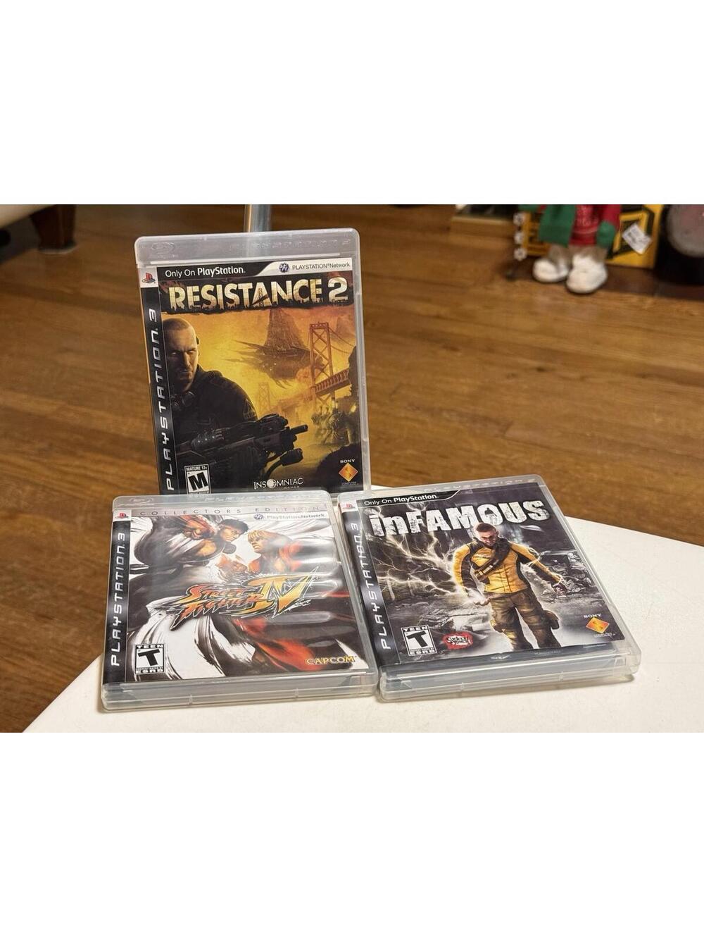 PS3 Games Lot Of 3 , Resistance 2, Street Fighter iV, Infamous